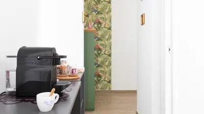 a coffee maker on a counter in a kitchen at Casa Otto in Rome