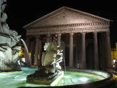 a statue in front of a fountain in front of a building at Indimenticabili VACANZE ROMANE nel cuore della città in Rome