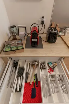 a refrigerator filled with lots of kitchen utensils at Il Melograno Holiday House in Rome