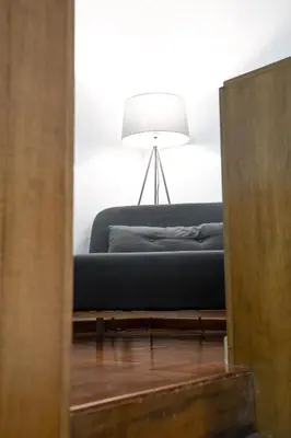 a bedroom with a bed and a lamp in a room at Vatican Apartment Borgo Pio in Rome