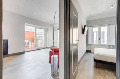 a bedroom with a bed and a room with a bed sqor at Trevi area Penthouse in Rome