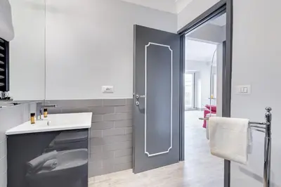 a bathroom with a shower and a sink at Trevi area Penthouse in Rome