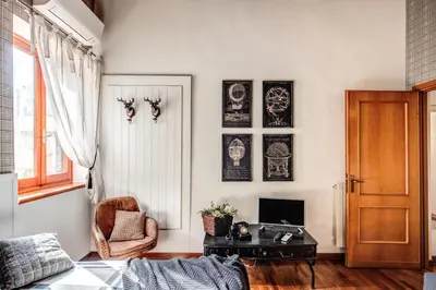 a living room with a couch and a table at Colosseo Miracle Suite in Rome