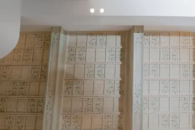 a room with tiled walls and a wall with glass doors at Navona Style in Rome