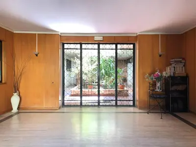 an empty room with a large glass door to a patio at Studio Flat Vaticano in Rome