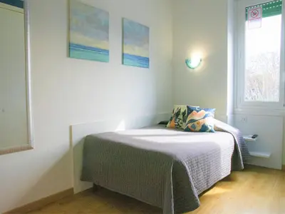 a bedroom with a bed in a room with a window at B&B Dea Tiburtina in Rome