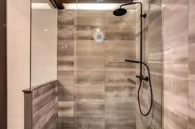 a shower with a glass door in a bathroom at 11 Via di Sant'Eligio in Rome