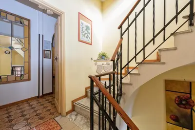 a winding staircase in a home with a stair case at A Vinicius et Mita in Rome