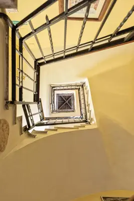 a stairwell in a building with a window at A Vinicius et Mita in Rome