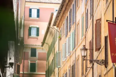 an alley in an italian city with buildings at POP Art B&B in Rome