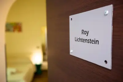a sign on a door with the words roxy liberalism at POP Art B&B in Rome
