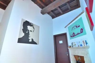 a room with a picture of a man on the wall at POP Art B&B in Rome