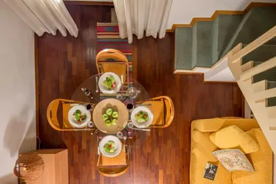 an overhead view of a table with plates of food at Navona White Apartment in Rome