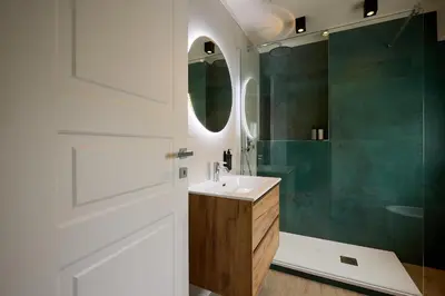 a bathroom with a sink and a shower at Relais Tiburtina in Rome