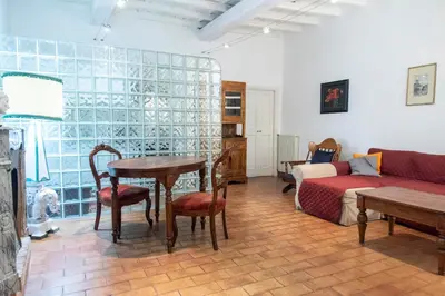 a living room with a table and a couch at Monti Bespoke in Rome