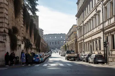 a city street with cars parked on the side of the road at Monti Bespoke in Rome