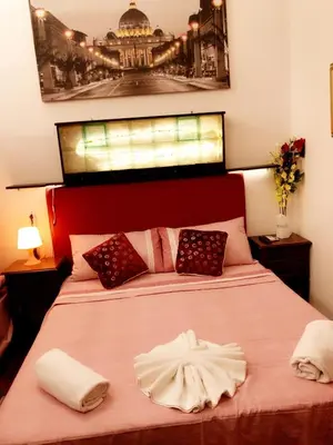 a bedroom with a bed with two towels on it at affittacamere sereno in Rome