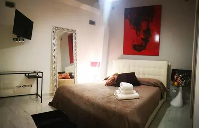 a bedroom with a bed with two towels on it at Spagna Gregoriana 46 in Rome