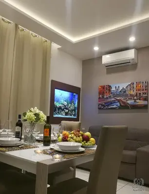 a dining room with a table with fruit on it at Giglio Luxury Apartment - Romantic Jacuzzi in Rome