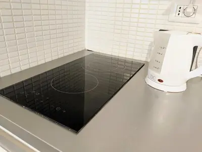 a kitchen counter with a coffee maker on a counter at Urbana Coliseum House in Rome