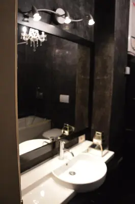 a bathroom with a sink and a mirror at Una finestra su Castel Sant'Angelo in Rome
