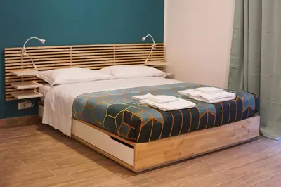 a bedroom with a bed with two towels on it at Roma Trasteverina in Rome
