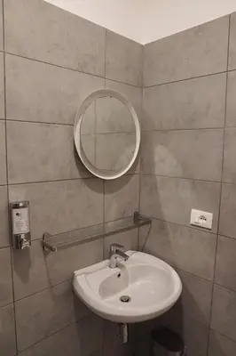 a bathroom with a sink and a mirror at Roma Trasteverina in Rome