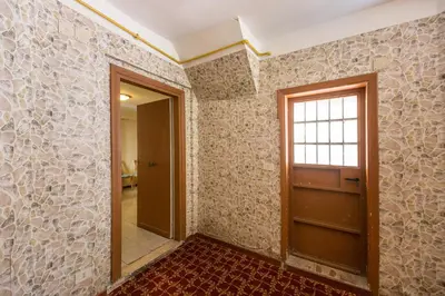 an empty room with a door and a window at Buonarroti Suite in Rome