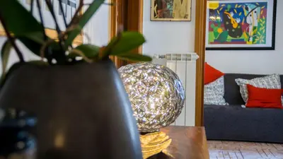 a living room with a table with a disco ball on it at Mid House in Rome