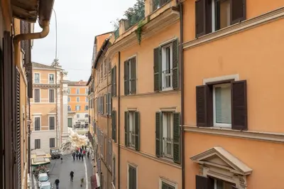 a view of a city street from a building at T-House Fontana di Trevi in Rome