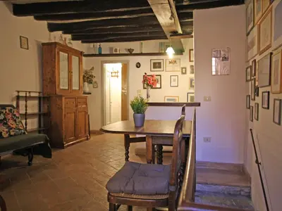 a dining room with a table and a couch at Terrace Apartment - Heart of Trastevere in Rome