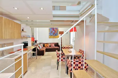 a kitchen and living room with a loft conversion at Design Loft Campo dei Fiori in Rome