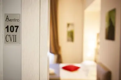 a close up of a door with a hotel room at Aventino Guest House in Rome