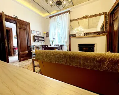 a living room with a couch and a fireplace at St. Petrus et Aurelia in Rome