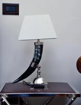 a lamp sitting on top of a table at Regal House Roma Navigatori 23 in Rome