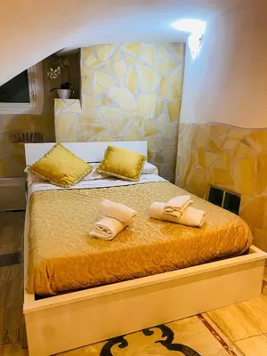 a bedroom with a bed with two towels on it at Ancient Roman Mansion in Rome