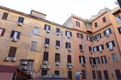 an old building with many windows in a city at Sunny Home in Rome