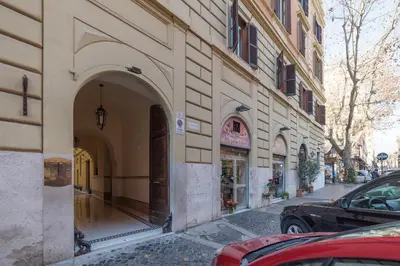 a building with an archway on the side of a street at Casa Fellini - Charme Holidays in Rome