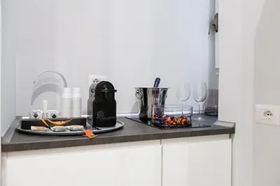 a kitchen counter with a plate of food on it at Opera Private Suites by Premium Suites Collection in Rome