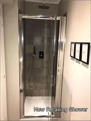 a shower with a glass door in a bathroom at Giuly'S House Cozy & Comfy Apartment in Rome ....Real Rome !!! in Rome