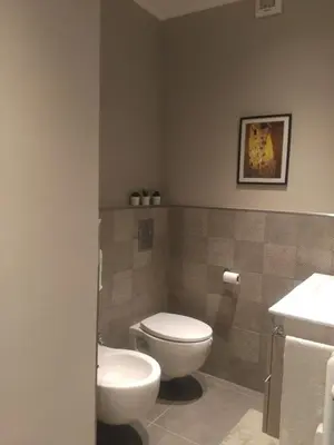 a bathroom with a toilet and a sink at Giuly'S House Cozy & Comfy Apartment in Rome ....Real Rome !!! in Rome
