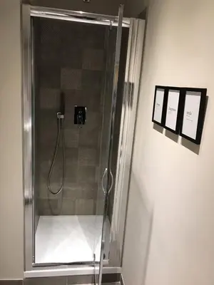 a shower with a glass door in a bathroom at Giuly'S House Cozy & Comfy Apartment in Rome ....Real Rome !!! in Rome