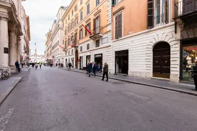 a city street with people walking down the street at EMERALD Luxury Suite Apartment in Rome