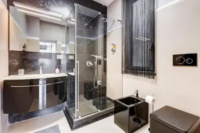 a bathroom with a shower and a sink at EMERALD Luxury Suite Apartment in Rome