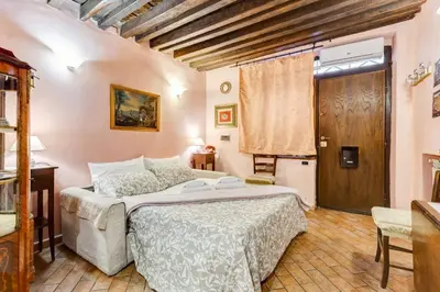 a bedroom with a large bed in a room at Colosseum Rione Monti 1 in Rome