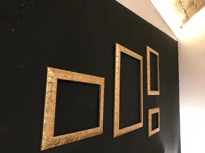 a group of three frames hanging on a wall at CasAphrodite in Rome