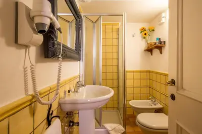 a bathroom with a sink and a toilet at Bollo Apartments in Rome