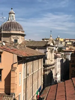 a view of the roofs of buildings in a city at San Daniele Bundi House in Rome