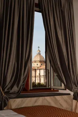 a view of a building through a window at Hotel Roma Vaticano in Rome