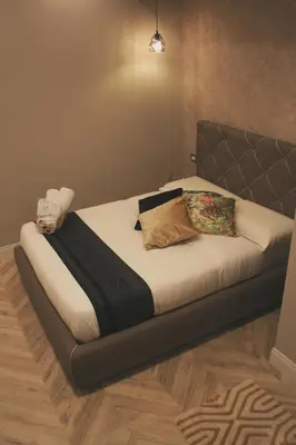 a bed with two pillows on it in a room at Hotel Roma Vaticano in Rome